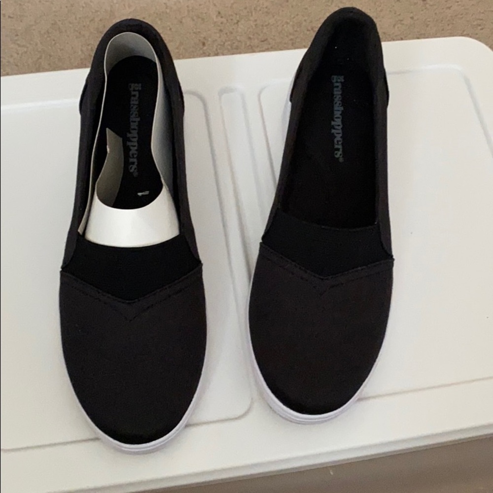 Black Grasshopper brand canvas slip on.